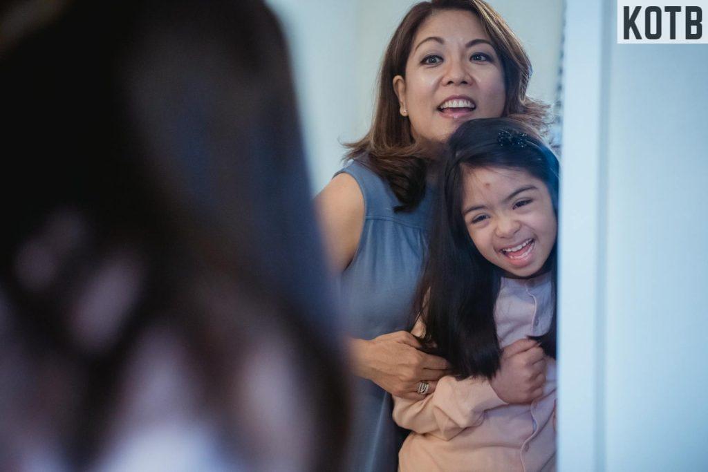 A Mother and Daughter Looking at the Mirror Together
