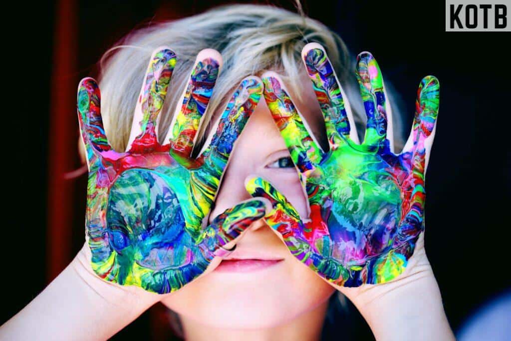 A KId With Multicolored Hand Paint