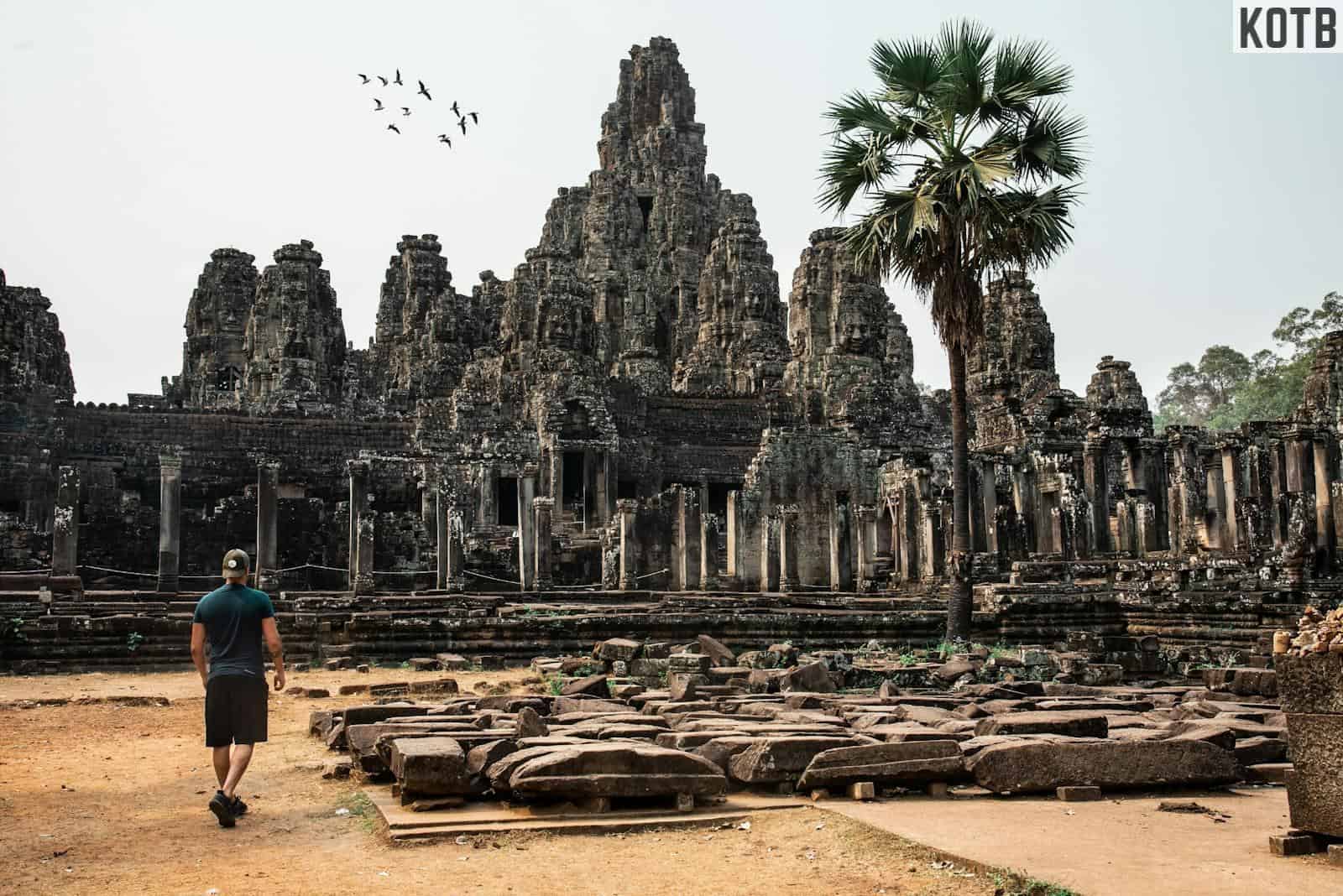 Man Looking At An Ancient Temple