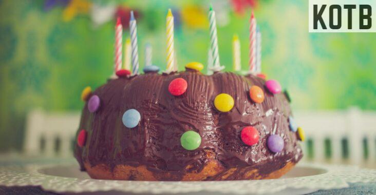 chocolate cake with nips and candles in close-up photography