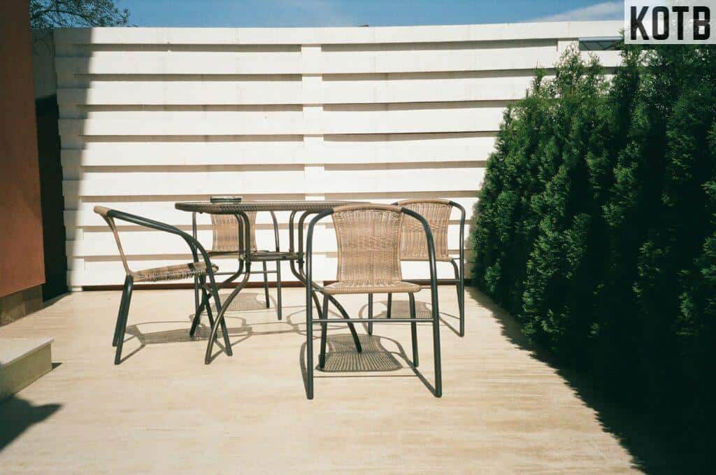 black metal framed white wooden table and chairs