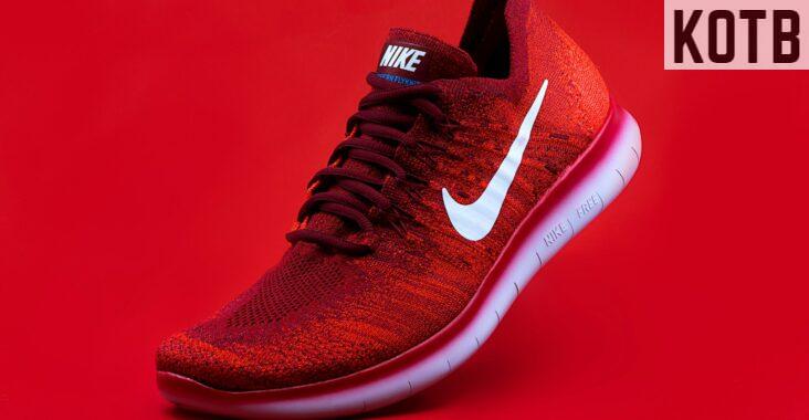 unpaired red Nike sneaker