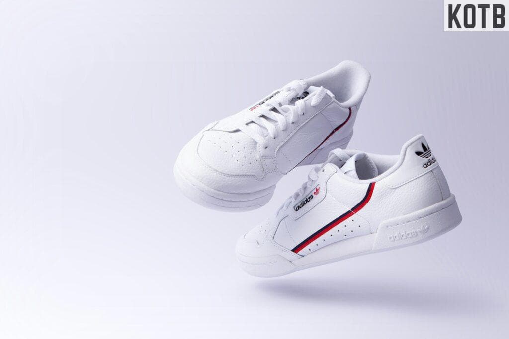 white adidas low-top sneakers