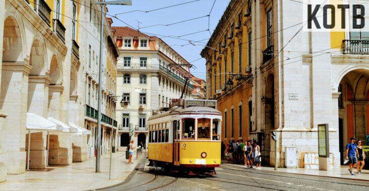 yellow and white tram on road during daytime