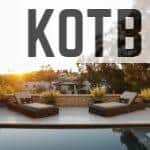 a pool with two lounge chairs and a view of a house