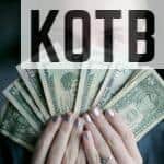 person holding fan of U.S. dollars banknote